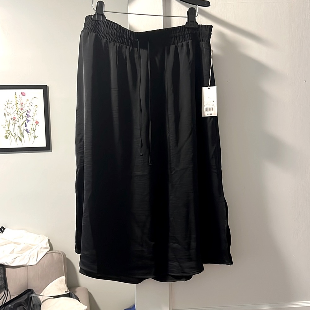 Black satin skirt. New unworn with tags!